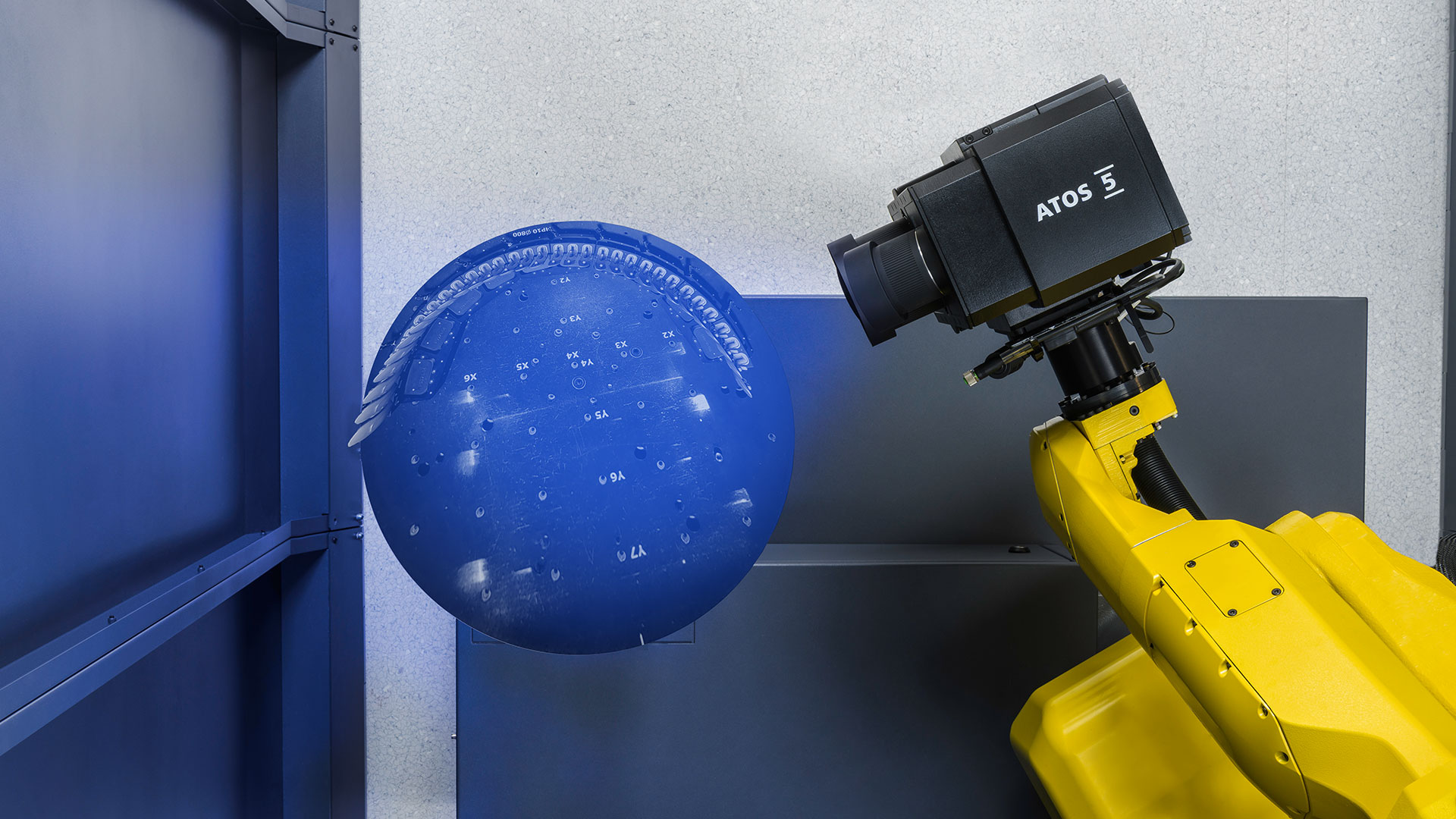 Automated ATOS 5 3D scanning knee implant components on a fixture inside ScanBox